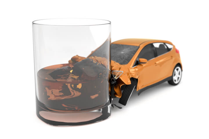 Drunk driving concept of small orange car collision with alcoholic drink isolated on white background