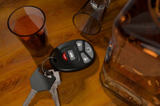 Shot glasses and whiskey bottle with car keys on bar DUI concept free drunk driving image