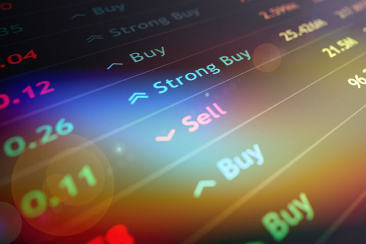 Stock ticker chart with buy, sell, and strong buy recommendations with lens flare