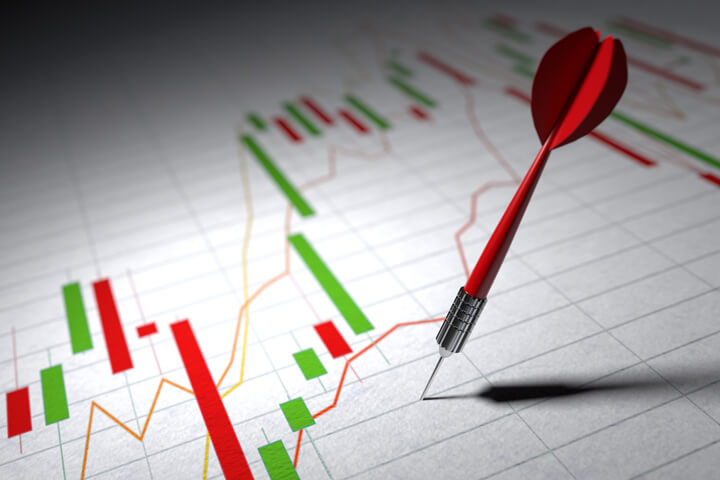 White paper showing stock price volatility and dart stuck representing poor investment strategy