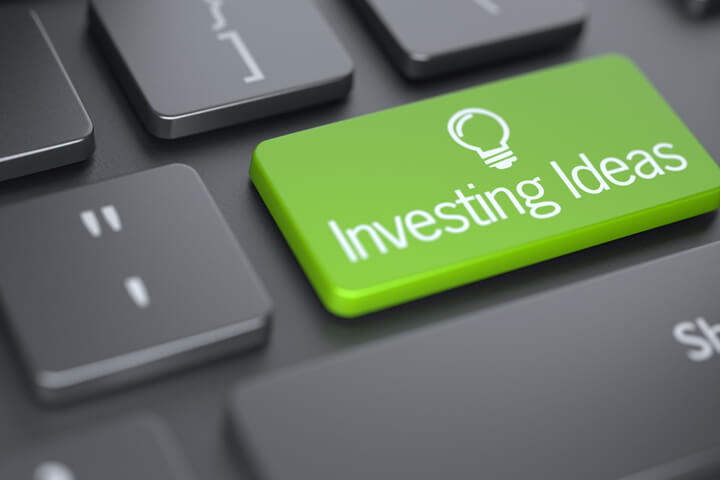 Computer keyboard with large green Investing Ideas key concept
