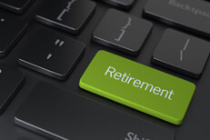 Dark laptop keyboard with green Retirement key