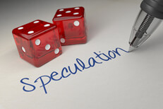 Dice with Speculation Paper with ballpoint pen writing word Speculation with two red dice