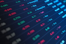 Stock listings angled Stock exchange ticker listings at angle and perspective with light blue lighting