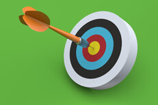 Orange dart hits colorful target with green background