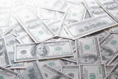 Scattered 100 dollar bills with corner highlight