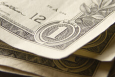 Free photo of random stack of one dollar bills corner view