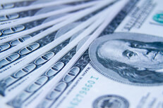 $100 bills evenly fanned out