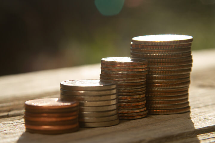 Increasing stacks of pennies, nickels, dimes, and quarters like chart