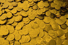 Large pile of gold coins representing treasure, wealth, riches, or investment