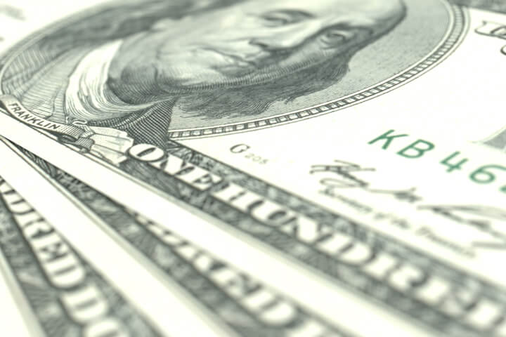 Image showing three 100 dollar U.S. bills close up at angle with short depth of field