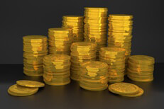 Photo of many stacks of U.S. gold coins on dark background