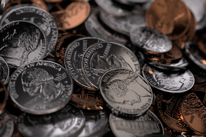 U.S. coins randomly dropped onto table