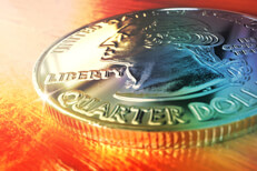 U.S. quarter lying on wood with strong color overlay
