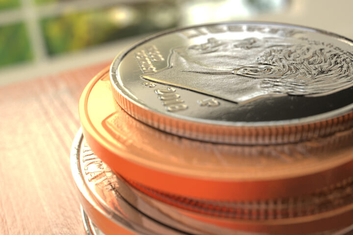 Stack of U.S. coins with window in background