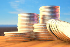 Daylight photo of different size stacks of U.S. quarters