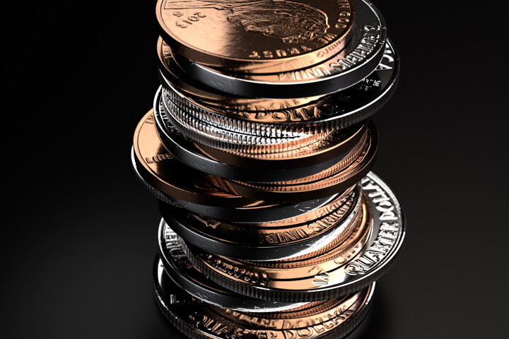 Large vertical stack of shiny U.S. coins on black background