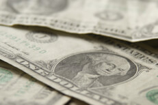 Random pile of wrinkled and crumpled dollar bills