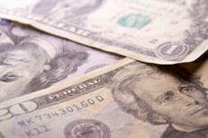 Miscellaneous U.S. currency bills scattered