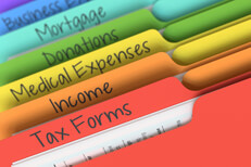 Colorful tax category folder tabs for forms, income, expenses, deductions, and mortgage expenses