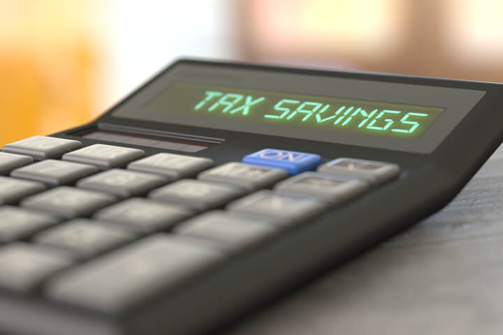 Perspective photo of calculator showing Tax Savings on LCD display