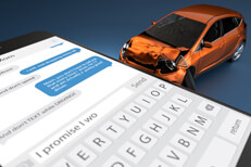 Side view of accident damage from car crashing into large cell phone