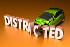 Distracted driving concept image Green compact car crashed into displaced DISTRACTED letters concept for distracted driving