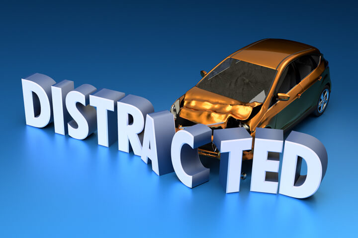 Orange car crashed into displaced DISTRACTED letters on blue background distracted driving concept