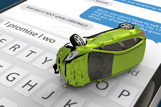 Text message rollover accident Small green car in rollover accident with extensive damage laying on cell phone screen showing text messages