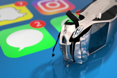 Phone app texting accident Small car damaged from rollover accident lying on cell phone screen showing text message app icon